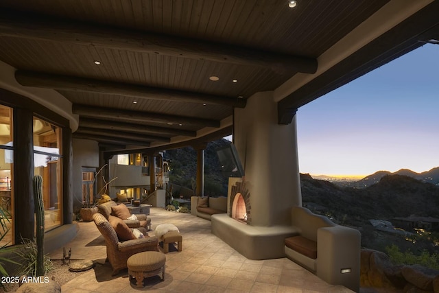 view of patio / terrace featuring an outdoor living space with a fireplace