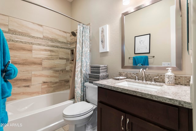 full bathroom featuring vanity, shower / bath combination with curtain, and toilet