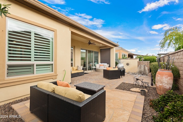 view of patio featuring an outdoor living space and ceiling fan