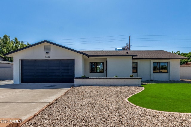 8602 N 42nd Dr, Phoenix, AZ 85051 - ranch-style home with driveway, a garage, a shingled roof, and a front lawn