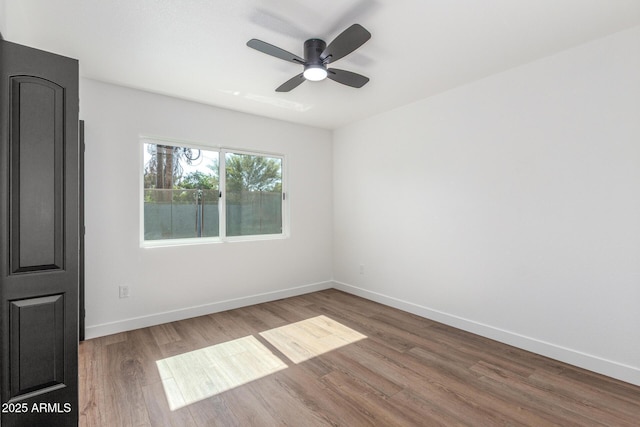 8602 N 42nd Dr, Phoenix, AZ 85051 - spare room featuring wood finished floors and a ceiling fan