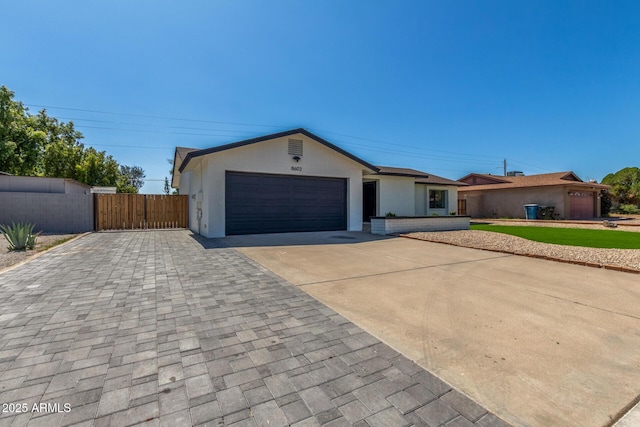 8602 N 42nd Dr, Phoenix, AZ 85051 - single story home featuring concrete driveway, an attached garage, stucco siding, and a gate