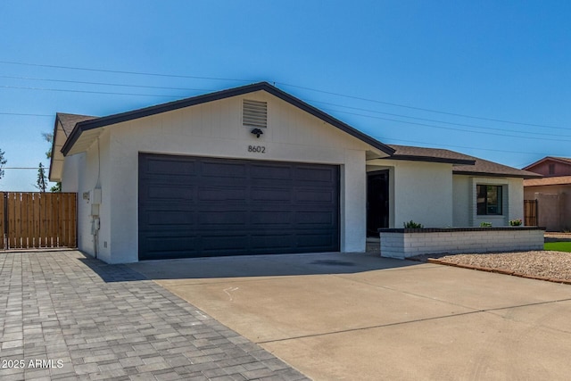 8602 N 42nd Dr, Phoenix, AZ 85051 - ranch-style home with driveway, a garage, stucco siding, and roof with shingles