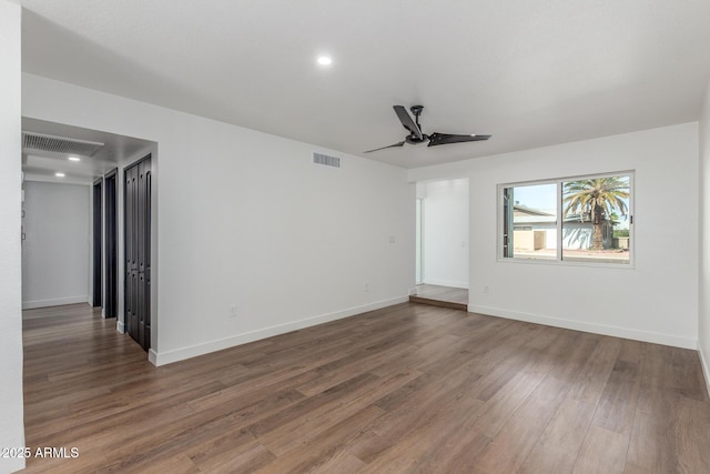 8602 N 42nd Dr, Phoenix, AZ 85051 - empty room with ceiling fan, wood finished floors, and recessed lighting