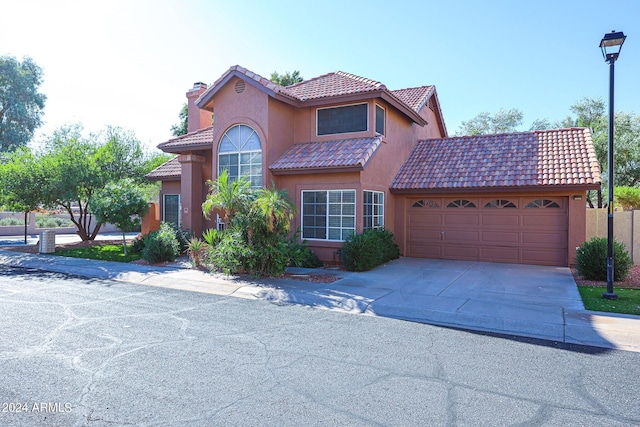 view of front of property with a garage