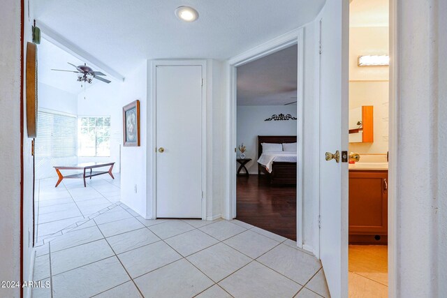 hallway featuring light tile patterned floors