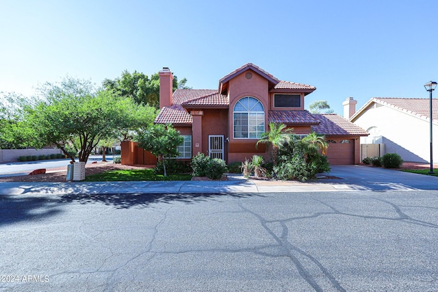 mediterranean / spanish-style house featuring a garage