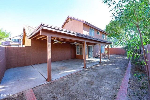 rear view of house with a patio and ceiling fan