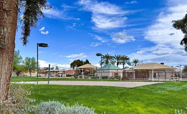 view of community with a lawn, a gazebo, and volleyball court