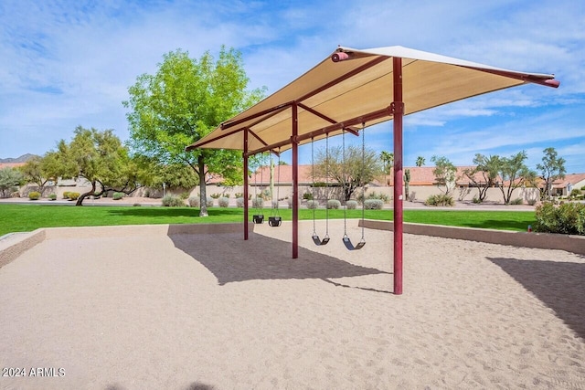 view of playground with a lawn