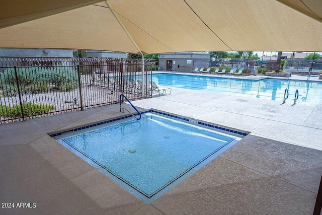 view of swimming pool featuring a patio