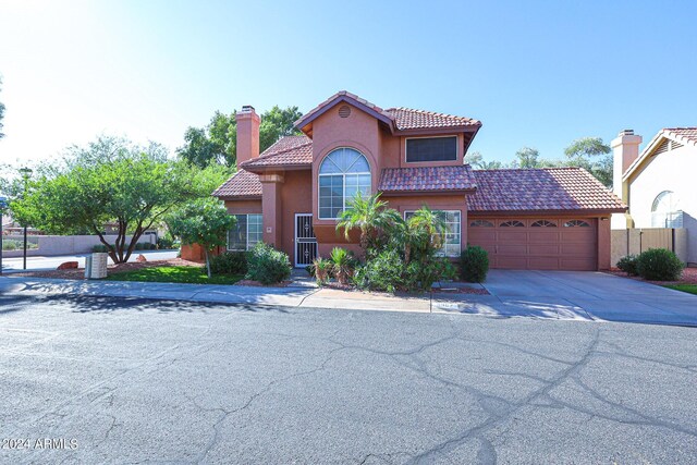 mediterranean / spanish-style house featuring a garage