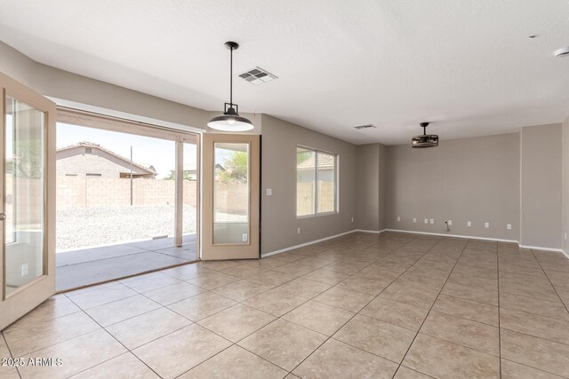 906 S 242nd Dr, Buckeye, AZ 85326 - empty room with light tile patterned floors and baseboards