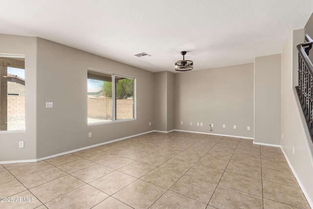 906 S 242nd Dr, Buckeye, AZ 85326 - unfurnished room featuring light tile patterned flooring and baseboards