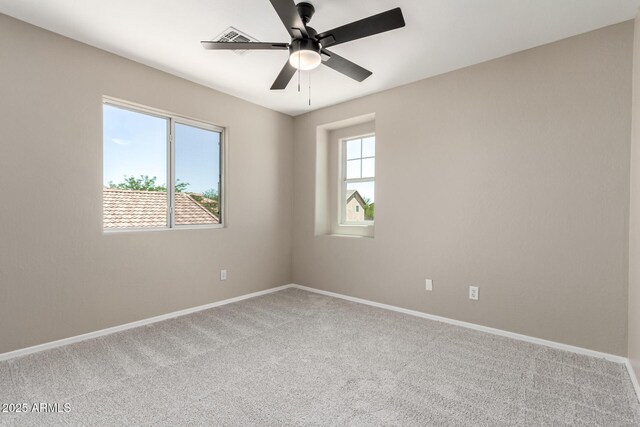 906 S 242nd Dr, Buckeye, AZ 85326 - empty room featuring carpet flooring, baseboards, and a ceiling fan