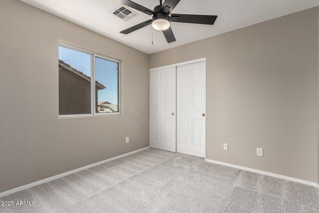 906 S 242nd Dr, Buckeye, AZ 85326 - unfurnished bedroom with carpet, baseboards, a closet, and a ceiling fan