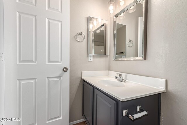 906 S 242nd Dr, Buckeye, AZ 85326 - bathroom with vanity and a textured wall