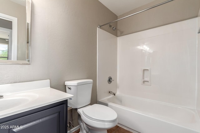 906 S 242nd Dr, Buckeye, AZ 85326 - full bath with vanity, toilet, a textured wall, and shower / tub combination