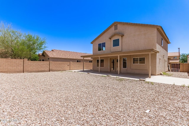 906 S 242nd Dr, Buckeye, AZ 85326 - rear view of property with stucco siding, a fenced backyard, and a patio area