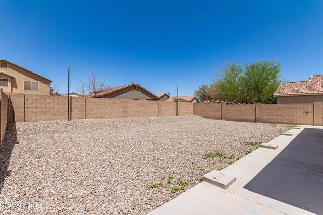 906 S 242nd Dr, Buckeye, AZ 85326 - fenced backyard with a patio