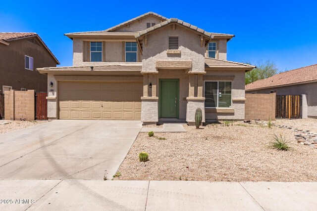 906 S 242nd Dr, Buckeye, AZ 85326 - traditional-style house with a garage, concrete driveway, stucco siding, and a tiled roof