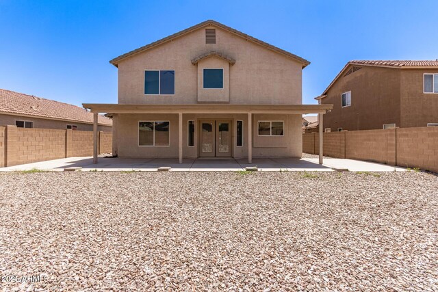 906 S 242nd Dr, Buckeye, AZ 85326 - back of house with a patio area, a fenced backyard, and stucco siding