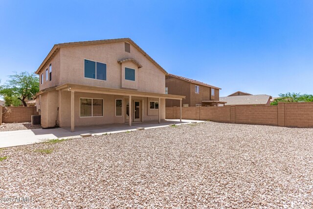 906 S 242nd Dr, Buckeye, AZ 85326 - rear view of property featuring cooling unit, a fenced backyard, a patio, and stucco siding