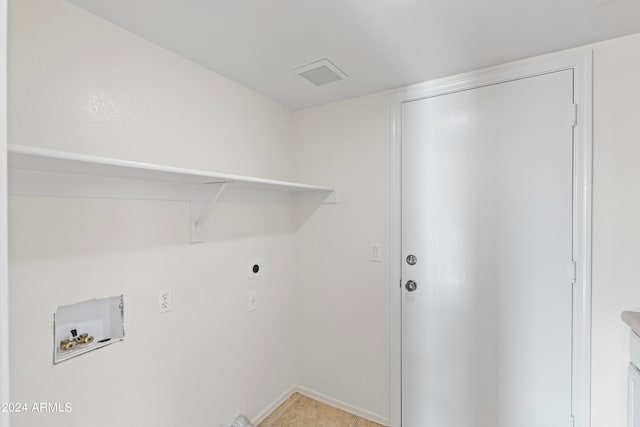 laundry room featuring hookup for an electric dryer, light tile patterned floors, and hookup for a washing machine