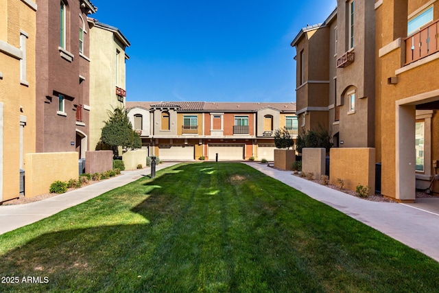 view of home's community featuring a residential view and a yard