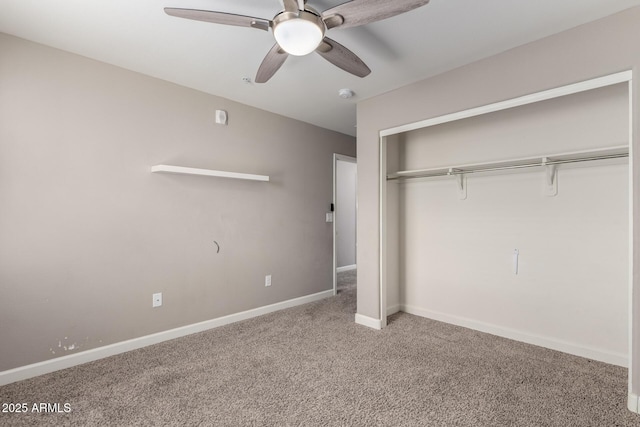 unfurnished bedroom with carpet floors, a closet, baseboards, and a ceiling fan