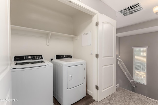 laundry room with laundry area, visible vents, and washing machine and clothes dryer