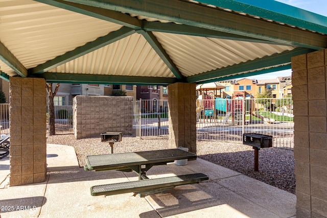 view of home's community with a residential view, fence, and playground community