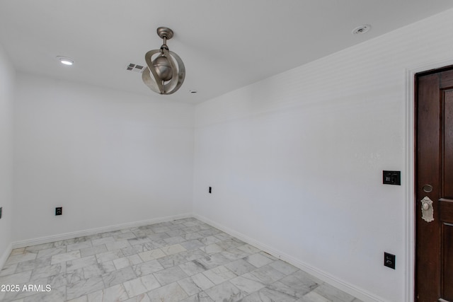 empty room with recessed lighting, baseboards, visible vents, and marble finish floor