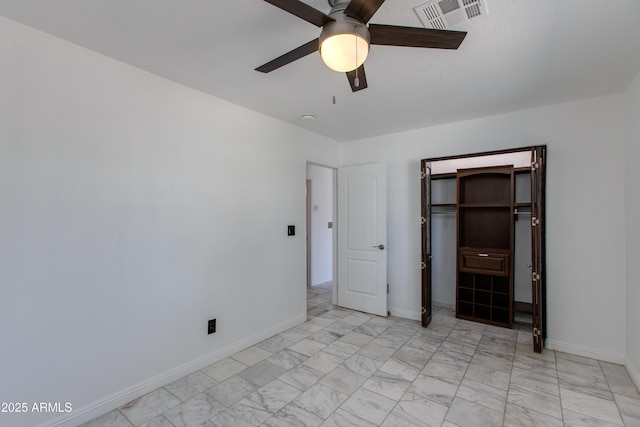 unfurnished bedroom with a ceiling fan, baseboards, visible vents, and marble finish floor