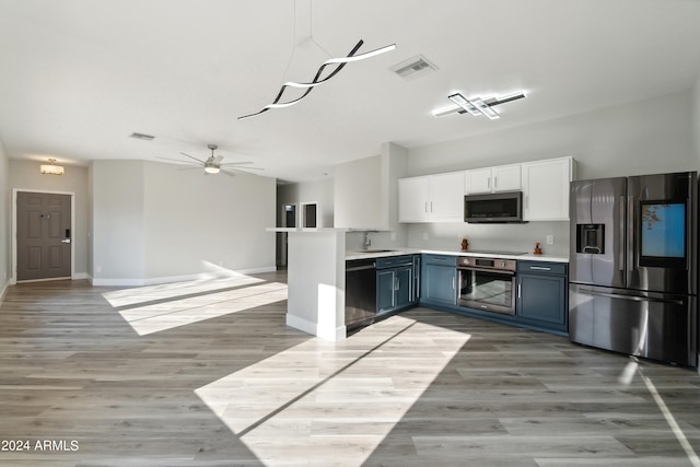 kitchen with blue cabinets, white cabinets, ceiling fan, sink, and appliances with stainless steel finishes