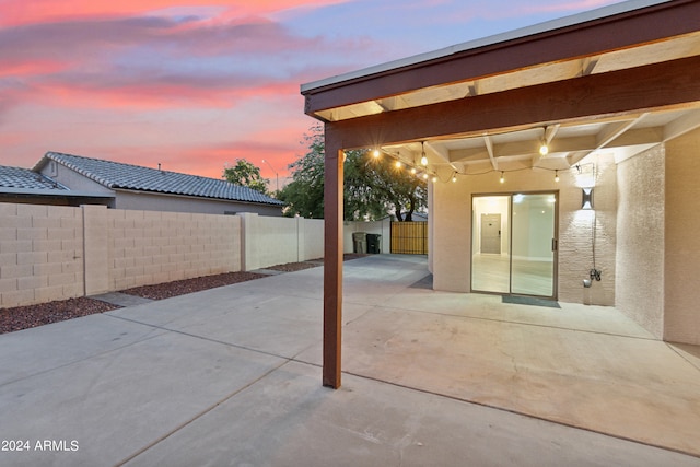 view of patio terrace at dusk