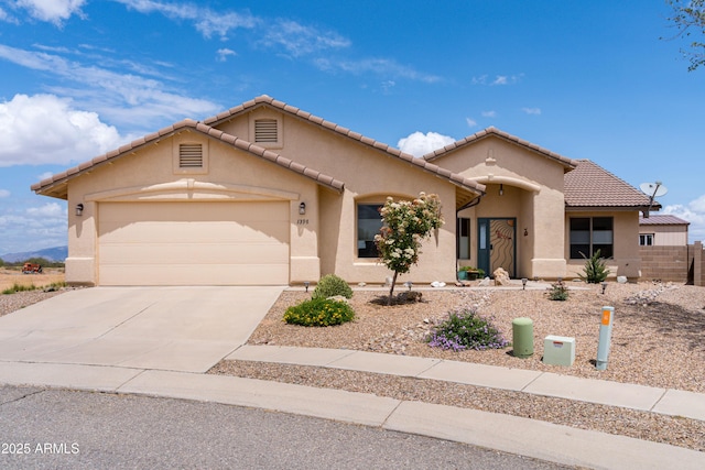 1398 W Sheep Wash Way, Benson, AZ 85602 - mediterranean / spanish home featuring stucco siding, a garage, concrete driveway, a tiled roof, and fence