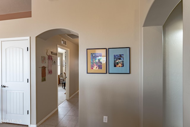 1398 W Sheep Wash Way, Benson, AZ 85602 - hall with light tile patterned flooring, baseboards, and arched walkways