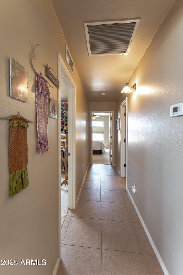 1398 W Sheep Wash Way, Benson, AZ 85602 - hall featuring light tile patterned floors and baseboards