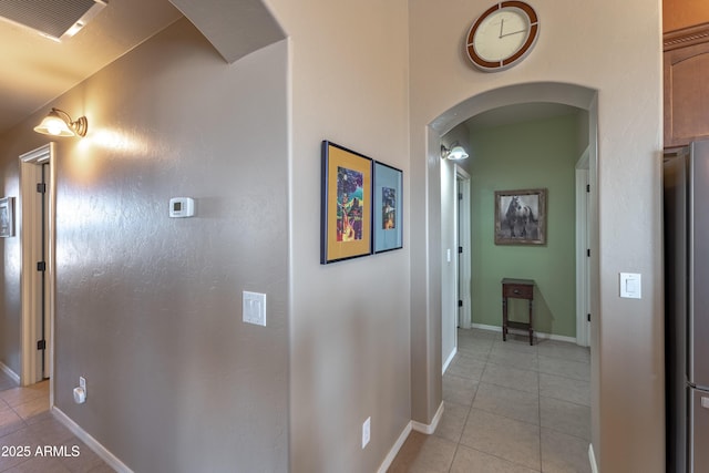 1398 W Sheep Wash Way, Benson, AZ 85602 - corridor with light tile patterned floors, baseboards, and arched walkways