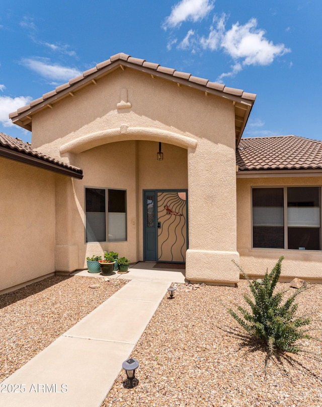 1398 W Sheep Wash Way, Benson, AZ 85602 - doorway to property featuring stucco siding and a tile roof