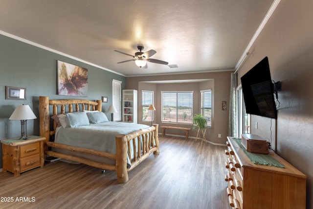1398 W Sheep Wash Way, Benson, AZ 85602 - bedroom with wood finished floors, crown molding, baseboards, and ceiling fan
