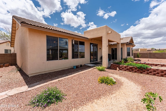 1398 W Sheep Wash Way, Benson, AZ 85602 - rear view of property with stucco siding, a tile roof, fence, and a patio area