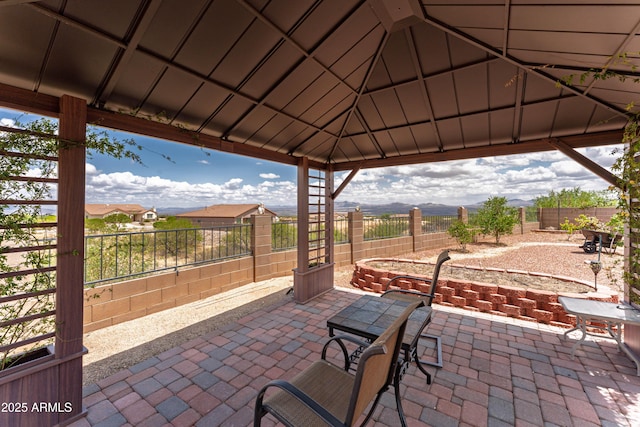 1398 W Sheep Wash Way, Benson, AZ 85602 - view of patio with a gazebo, a fenced backyard, and a mountain view