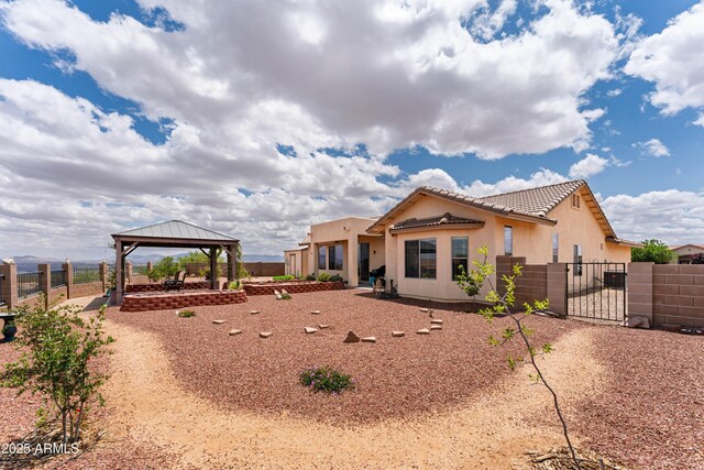 1398 W Sheep Wash Way, Benson, AZ 85602 - view of front of property with a gazebo, a tile roof, fence, stucco siding, and a gate