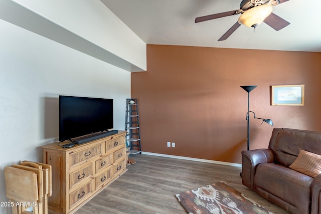 1398 W Sheep Wash Way, Benson, AZ 85602 - living area with wood finished floors, ceiling fan, and baseboards
