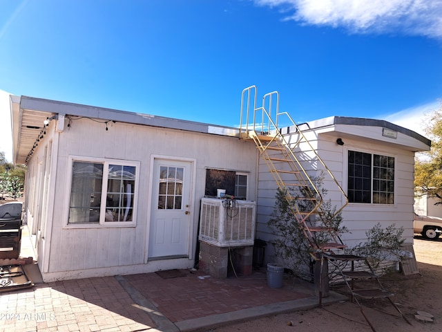 rear view of house featuring a patio