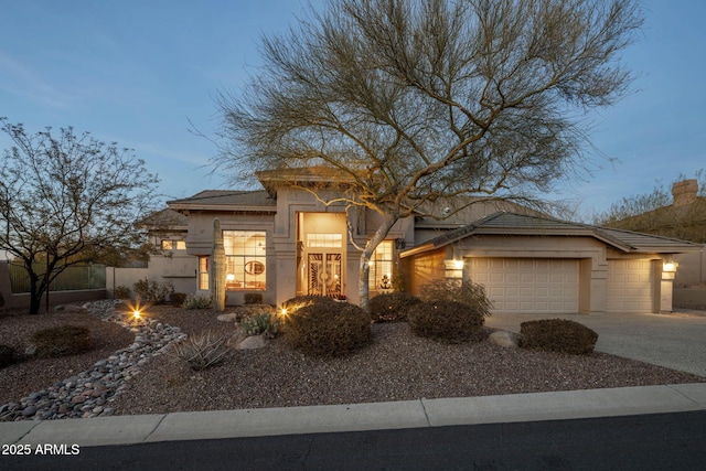 view of front of property featuring a garage