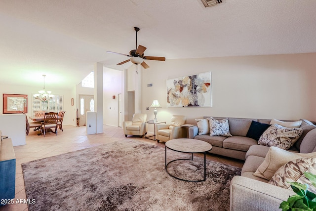 tiled living room featuring high vaulted ceiling, ceiling fan with notable chandelier, and a textured ceiling