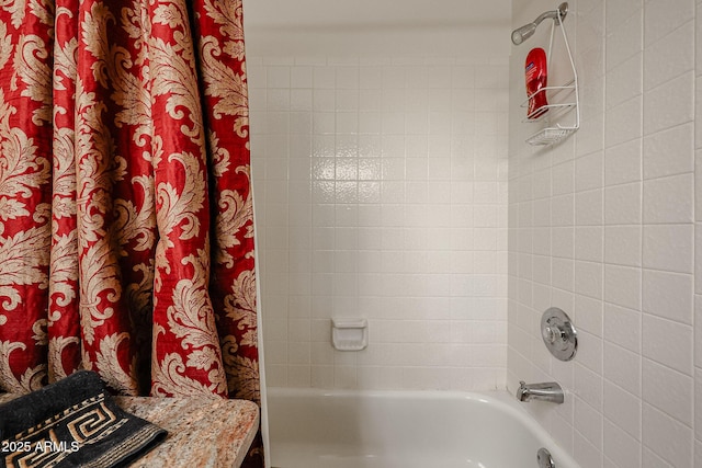 bathroom featuring shower / bathtub combination with curtain